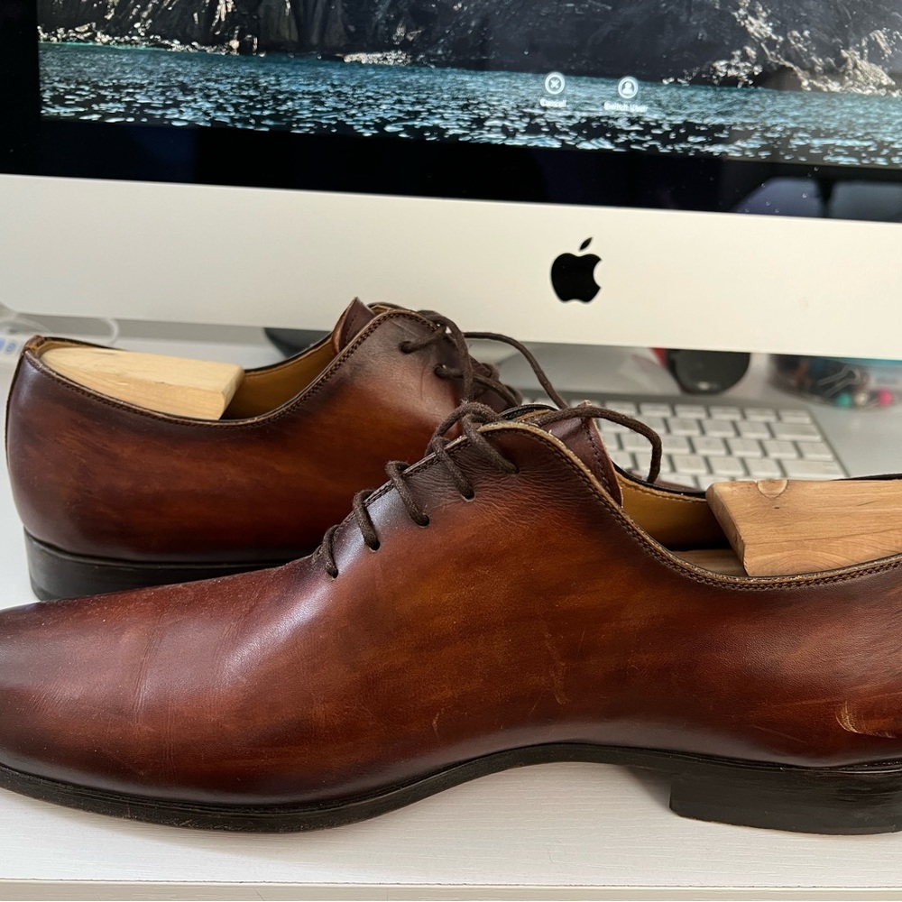 Italian made brown leather Magnanni shoes are gently used, Excellent condition..